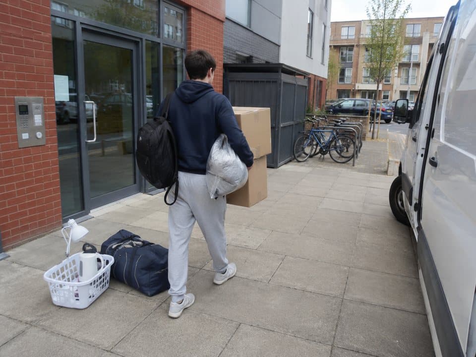 Student removals in London: trolley stacked with boxes in the entrance of a London building